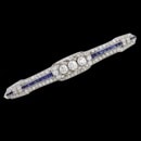 A very pretty Art Deco diamond and sapphire platinum from the 1920's.  The piece is set with 92 single cut and full cut diamonds weighing approximately 1 1/2ct.  The three center diamonds weigh approximately 1.0ct plus. These are set in bezels.  Set one each side of the major diamonds are 24 total natural blue French  cut sapphires.  Pin measures 3 inches and weighs 9.4 grams. Slight dip on one side see photos.