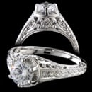 A gorgeous platinum Edwardian era style hand carved filigree diamond engagement ring.  Made for a 3/8ct to 1 1/4 ct diamond (center diamond not included) Set with .24ct of VS F ideal cut diamonds. The finest die struck ring made. 8.2mm at the top and tapers.  Made in America.