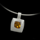 A beautiful sterling silver and citrine pendant by Bastian Inverun. The pendant features and brushed hammered finish and cushion shape citrine weighing 1.20 carats. The pendant measures 16m x 16m not including the bail and is suspended from a snake chain.