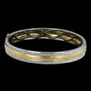 Two tone 18 karat gold bangle bracelet from Spark. The bracelet is set with 1.22 carats total weight of round diamonds. There are two rows of diamonds on the opposite side of this bracelet.