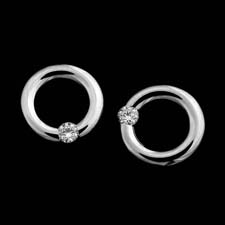 Kretchmer's platinum micro earrings with two round brilliant diamonds, tension set and available in a matte finish or high polished(shown).