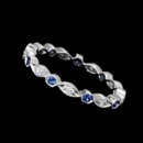 This unique and intricate 18kt white gold Beverley K wedding eternity band features .12ctw in diamonds and .36ctw in brilliant blue sapphires.  This ring measures 2.3mm wide. Size 6