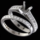 A platinum engagement ring with a matching 18kt white gold wedding band.  Thr rings are set with 36 full cut ideal VS F-G quality diamonds, .60ct total. The width of both are 4.9mm, the rings are currently soldiered together and are a size 4 1/4.  Center diamond is NOT INCLUDED but the ring needs a .85-1.1c round center. Good buy and can be altered to a degree.