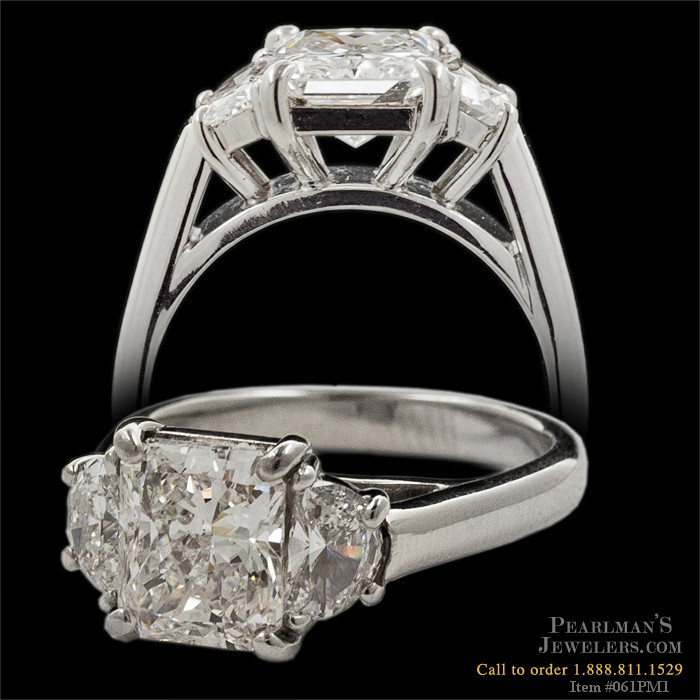 A very fine hand made platinum 3 stone diamond ring. The r..
