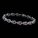 A very beautiful 18 karat gold ruby and diamond Spark bracelet. The bracelet is set with 2.15 carats total weight of round diamonds and 1.92 carats total weigh of round rubies.