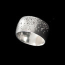A wide band by Bastian Inverun. This sterling silver ring is set with diamonds weighing 0.08 carats in total. The surface has a brushed finish and measures 11.8mm in width.