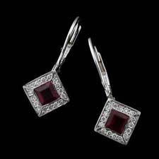 Platinum ruby and diamond earrings with pave diamonds on the bezel, by Chris Correia.