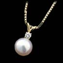 18kt yellow gold pendant with an 8.5mm white pearl and .11cts of diamonds