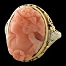 Probably one of the nicest coral rings we have come across. A 14kt gold stamped piece to have been made in the 1940's but the Coral is from a much earlier time. My estimate 1890's - 1910 ish? The coral has no wear so I would suggest it came from a earlier brooch. Regardless the carving is quite beautiful and this is the true Angel's skin coral. The mounting is absolutely pristine and solid 7.77 grams weight.The ring measures 21mm in length and is a size 8