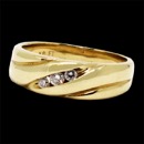 A beautiful 14k yellow gold diamond wedding band. This ring features 3 round cut diamonds and is great unisex band. The diamonds have a total carat weight of 0.15tcw and are VS-SI clarity.This band measures 6.77mm in width at the thickest and tappers to 3.4mm on the shank.
