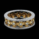 This ornate, handmade Michael Beaudry platinum and 18kt yellow gold diamond floral wedding band symbolizes whimsy and beauty. The ring is set with .32ctw of diamonds and is 6.5mm in width. In stock size 6.5.  This was a custom created piece, Exquisite!!