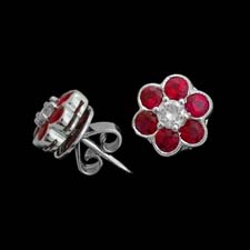 These adorable floral earrings feature ruby petals (.93cts.) and a diamond center (.19cts.).