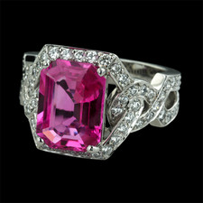 This is a classic ''Deco'' style Pink Sapphire and Diamond ring by Gumuchian.  The stone is a Madagascar octagon hot pink sapphire weighing 4.18ct.  Pave' set on the shoulders and around the top are .83ct. in diamonds.  This stone has very strong brilliant color and is definitely a statement piece. 13mm width.