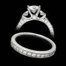 This platinum Scott Kay engagement ring features hand engraving and 0.61ctw in diamonds.  The matching wedding band has .25ctw diamonds and retails for $3360.00.