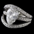 Interesting 18kt white gold diamond ring. The piece is set with a center Pear shaped diamond weighing 2.70ct. The stones quality is SI1 clarity, J-K color. There are 52 diamonds weighing 3/4ct of full cut round diamonds in the mounting. Pear shapes are hard to mount in rings for the shape does not lend well but this is really pretty and shows well. The ring is a size 5, measures 15mm at the top, and weighs 7.8 grams.  The diamond is non certified but accurately graded. Neat piece!  