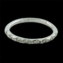 This beautiful engraved 18kt white gold diamond band by Diana Heinan. The ring contains .10ct. total weight in diamonds.  The ring is a size 5.75. 1.5mm width. Made in the USA