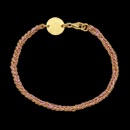 A pretty gold over sterling silver and Silk Peter Storm bracelet. This bracelet is woven with sterling silver that has a yellow gold vermeil and purple silk. Looks great on any skin tone. Comes in white, rose, and black colors. Call for more colors.