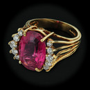 A gem oval 6.30ct Rubellite Tourmaline in a handmade 18kt gold mounting. The ring is set with 10 full cut diamonds weighing .50ct total weight. 
Finger size is a 6.25, but can be sized. VS F-G quality.  Really nice piece!!!