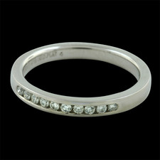 Beautiful Platinum channel set diamond band containing .15ct. total weight in diamonds. Size 6.25
