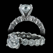 This is the best shared prong engagement ring made. This Memoire petite prong eternity band with head appears as a ring of fire around the finger. This is available in platinum or 18kt gold from .50ct to over 8.0ct in diamond weight and starts at $3025. Exquisite!! Center stone not included.