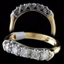 A very fine 18kt yellow gold diamond wedding band set with 5 full cut diamonds measuring 3.0mm ea. The diamonds are high VS2 to VS1,  F-G color and very fine cut grade. Ring measures 3.8mm and tapers to 2.2mm 

This is a size 4 1/2 and weighs 2.7 grams. 
 Ring is not stamped or hallmarked but test three times and is 18kt gold.  

Ring is in perfect condition.