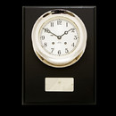 This handcrafted timepiece from Chelsea Clocks signals the passing of time with gentle, rich sounding chimes eight bells at 4, 8 and 12 o'clock to mark the end of a mariner's four hour watch, with one bell the first half hour after, plus one additional bell with each subsequent half hour. Behind its classic, hand silvered dial, 364 precision brass parts many plated with gold and 11 jewel movements, all of which are made in Chelsea, Massachusetts, ensure accuracy in time and enduring quality for years to come. A great clock in with a forged brass nickle plated case. This is a wonderful presentation piece. 
This clock is available in 4 1/2 inch, and 6 inch dial sizes.
Dimensions: 12" H x 9" W
Weight: 12 lbs.