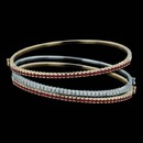 Spark's stackable prong-set bangles in 18K gold. The bangles are set with ruby and individually priced. The diamond bangle is set with  0.90 carats total weight and is priced separately.