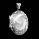 A beautiful 18kt white gold hand-carved locket from master English jeweler Charles Green. This locket measures 28mm X 23mm.