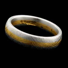 Gents 6mm band done in platinum with an 18kt yellow gold stripe designed by Christian Bauer. An all time classic.