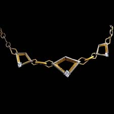 The marvel of design in the Astra necklace combines links of platinum and 20kt gold with 24kt gold inlay and diamonds. Intricate etchings with smooth and sharp lines are the foresight of Steven Kretchmer design. 