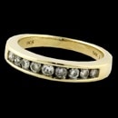 A 14kt yellow gold diamond channel set wedding band.  The ring is set with 9 diamonds weighing approximately 1/3ct total.  The ring is a size 7, weighs 3.7 grams, and is 3.7mm in width and tapers.  

The diamonds are in the SI2 clarity range and I-J color.  The ring is in perfect condition.