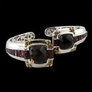 A contemporary design from Bellarri that is sterling silver with two black onyx and rhodolite along the center. The weight of the black onyx is 15.20tcw and the weight of the rhodolite is 8.60tcw. The outer corners of above the black onyx are made of 18K gold. The height of the bracelet is 27mm