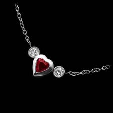 .30ctw ruby heart sided with bezel set diamonds on either side and matched with a 1mm cable chain, designed by Chris Correia.