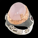 A beautiful sterling silver rose quartz ring from Bellarri. The ring has two rhodonite on the side, with a weight of 0.90tcw. The rose quartz has a weight of 12.40tcw. The signature "B" has two small diamonds weighing 0.01tcw.
