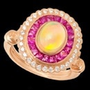 A beautiful Opal and ruby Beverley K ring. This ring features French cut rubies and diamonds in 18k rose gold. The center opal is 1.40 carats. Surrounding the opal are a halo of red rubies. The total carat weight of the rubies is 1.10 carats. The diamonds along the outside of the rubies have a total carat weight of 0.32 carats. This is such a lovely rose gold ring from Beverley k that is sure to make anyone take notice.