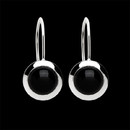 Simple luxury from Bastian Inverun. Round black onyx bezel set earrings in sterling silver. The earrings measure 9mm in diameter.
