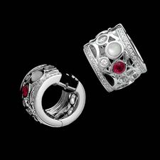 A wonderful pair of 18kt white gold diamond, ruby, onyx, and mother of pearl earrings from Chris Correia.  The Bubble collection is set with .34ct of diamond. 12mm width.  Serve with Champagne!