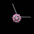 This is a beautiful 18k white gold flower pendant with alternating white diamonds and pink sapphires by Beverley K.  