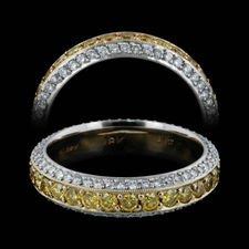 This gorgeous Michael Beaudry handmade platinum eternity wedding band shines with 1.53ctw of fancy intense yellow and white diamonds. This was a custom created piece, 4.80mm in width.