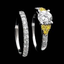 Contrasting elegance: The center stone of this Scott Kay engagement ring is set off by yellow round diamonds. The ring is comprised of a melody of metals: platinum, 18kt white and yellow gold. Center stone not included.