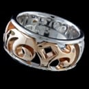 A unique sterling silver Bastian Inverun ring. This ring features a rose gold tone design going half way around the ring. The size of the ring is a 7.75 to the leading edge, this means that is should fit someone with a finger size of 7.25 to 7.5.