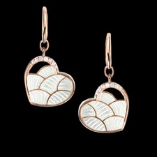 These dangle earrings feature white sapphires, set in sterling silver, plated with rhodium for easy care. The center reflects and moves with the light giving it a 3D effect.