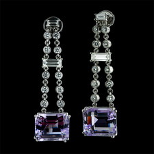 These ''One of a Kind'' diamond and amethyst earrings by Gumuchian are done in platinum.  The baguette shaped amethysts have a total weight of 16.37ct.  They are suspended from a drop that contains baguette and round diamonds with a total weight of 2.35ct. The earrings dangle 1 3/4 inches in length.