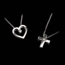 The white gold heart with a .02ct diamond is $510.00. The cross is also white gold with a .02ct diamond and costs $460.00.