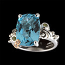 A stylish sterling silver blue topaz ring from Bellarri. This ring is from the Madam B collection and the total carat weight of the blue topaz is 8.70. There are two small diamonds in the signature "B" that weigh 0.01tcw.