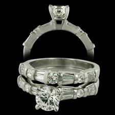 This beautiful platinum and diamond bridal set by Sasha Primak contains an Eight Star Round Brilliant diamond in the center. The mounting contains a combination of round and baguette diamonds with a total weight of .52ct. ring.  The wedding band is also a combination of round and baguette diamonds for a total diamond weight of .44ct. 