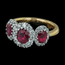 Spark's three stone ruby ring from the Classico collection is one our best sellers. Set in 18 karat gold with 1.90 carats total weight in oval rubies and 0.54 carats in round diamonds.