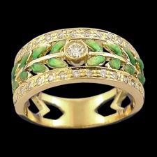 A art nouveau inspired ring made of 18k gold and enameled green leaf design. There are 27 diamonds on this ring that has a total carat weight of 0.25tcw. The ring measures 9 x 20 mm and weighs 5.64 grams.