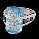 A Blue Topaz and Iolite with diamonds around half of this Bellarri ring. The pretty blue topaz has a carat weight of 22.40 and the lolite has a carat weight of 1.40, the total diamond carat weight is 0.38. The ring measures 18mm x 12mm.  A good size that is not too over powering on your finger. A perfect Bellarri jewelry piece to give to yourself of a loved one.