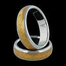 The Polarium Channel wedding band for him, from Steven Kretchmer, with a channel of inlayed 24k gold complimented by an exquisite high polish shine, possesses a unique and irresistible attraction, causing them to join in a kiss the moment their bodies touch. This ring is 6.0mm wide and priced in a size 9.